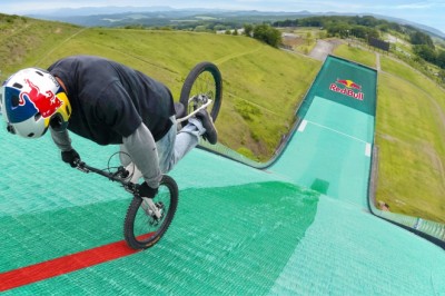 Trials Bike Rider Sets Two World Records by Riding Backward on One Wheel Down a Steep Ski Slope