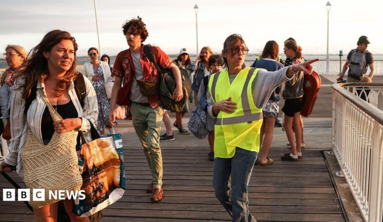 Tens of thousands evacuated from French tourist spot and near Madrid as wildfires spread